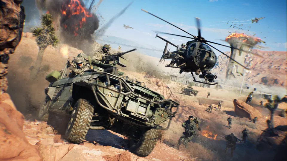 Battlefield 6: vojáci u obrněného vozidla a vrtulníku v pouštní krajině, za nimi výbuchy a další jednotky
