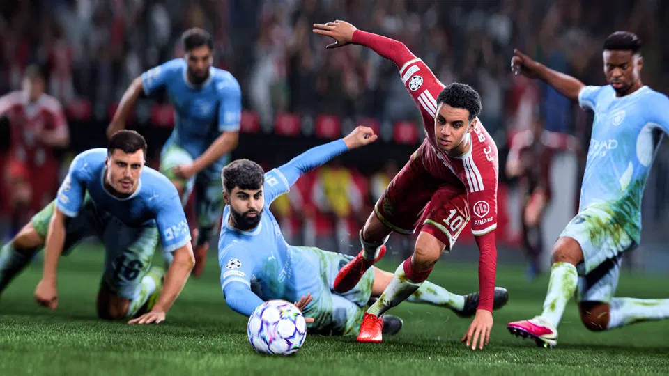EA Sports FC 27: hráči v modrých a červených dresech bojují o míč na trávníku během zápasu.